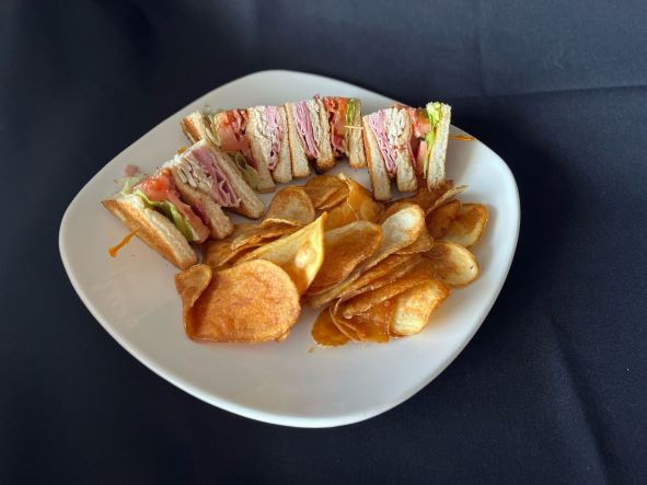 Clubhouse sandwich with fries
